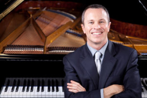 Michael Adcock with piano