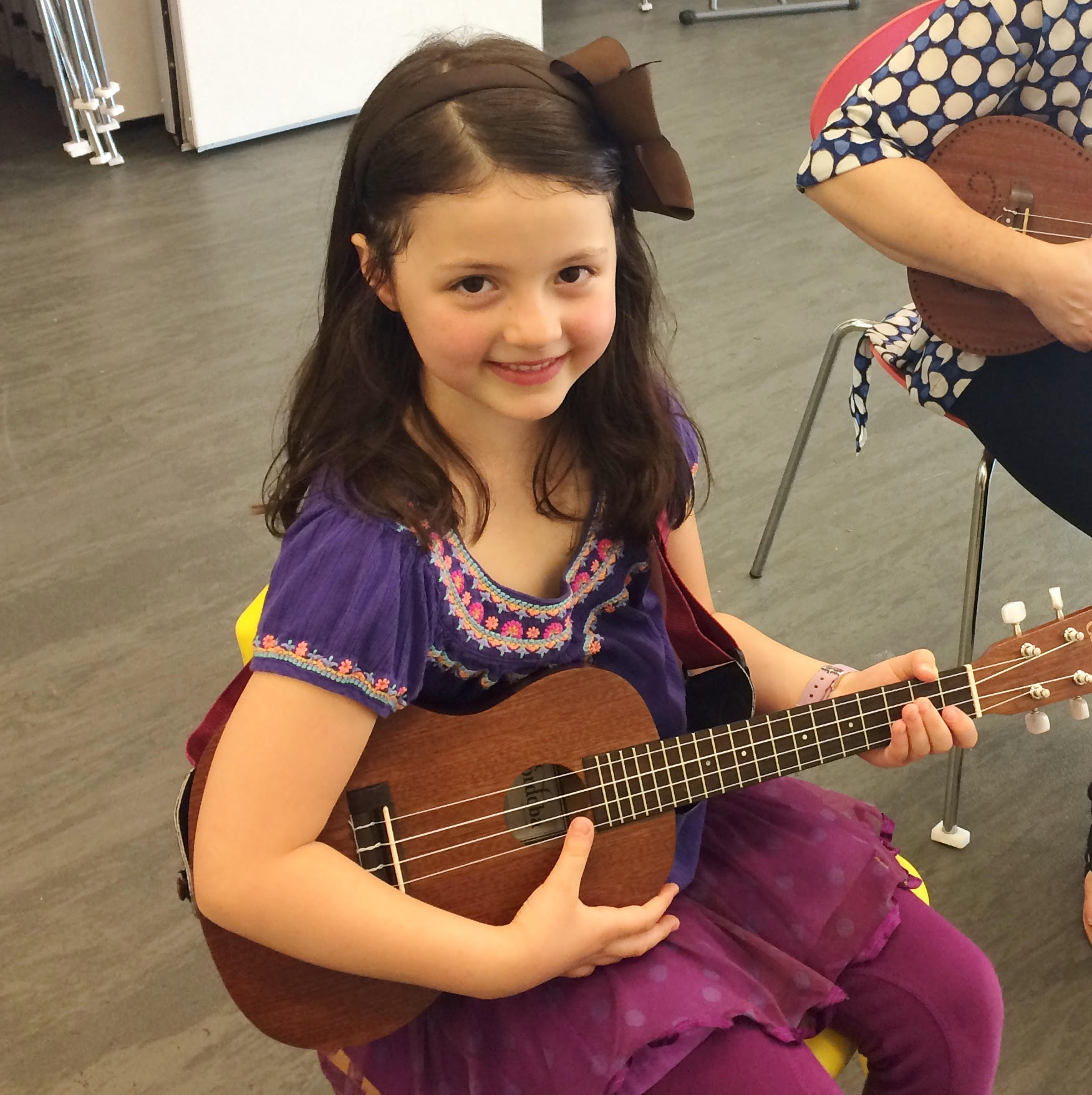child playing the ukulele