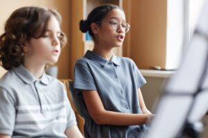 Group of children singing in class