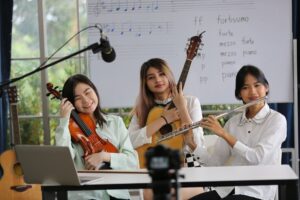 Women musical band playing instruments in background. Online home studio plays and sing a song.