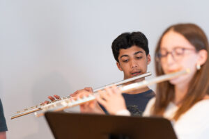 Students learning music together in a group class