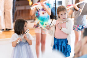 Young flute students practicing