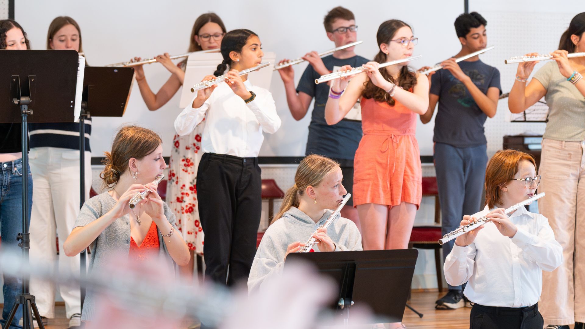 Students taking a group flute lesson